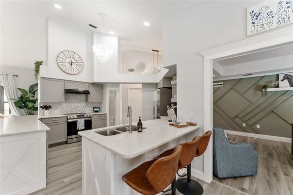 Chandelier, Interior, Kitchen, Pendant Lights, Recessed Lighting, Stainless Steel Appliances, Wood Texture Flooring