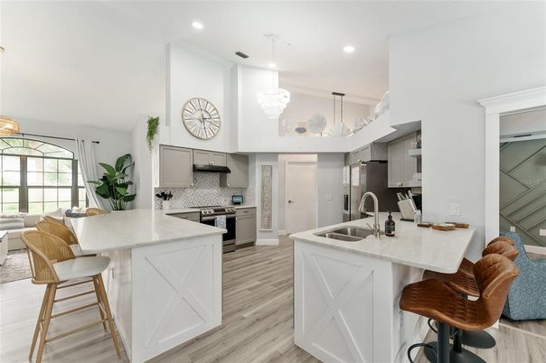 Chandelier, Interior, Kitchen, Pendant Lights, Recessed Lighting, Stainless Steel Appliances, Wood Texture Flooring