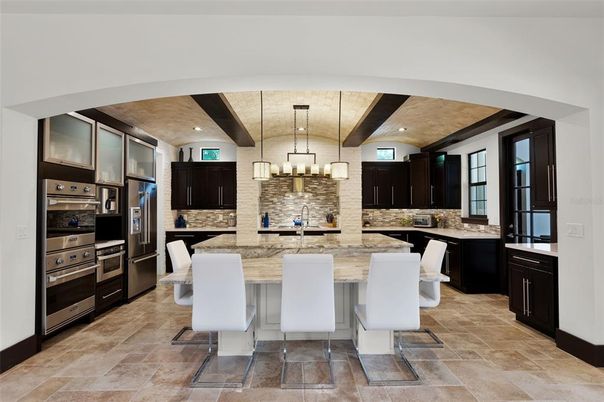 Chandelier, Interior, Kitchen, Pendant Lights, Recessed Lighting, Stainless Steel Appliances, Stone Walls, Wooden Beams
