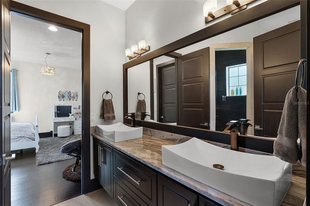 Bathroom, Dual Sink Vanities, Interior, Pendant Lights, Recessed Lighting, Wood Texture Flooring