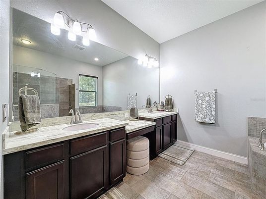 Bathroom, Dual Sink Vanities, Glass Shower, Interior, Recessed Lighting, Wood Texture Flooring