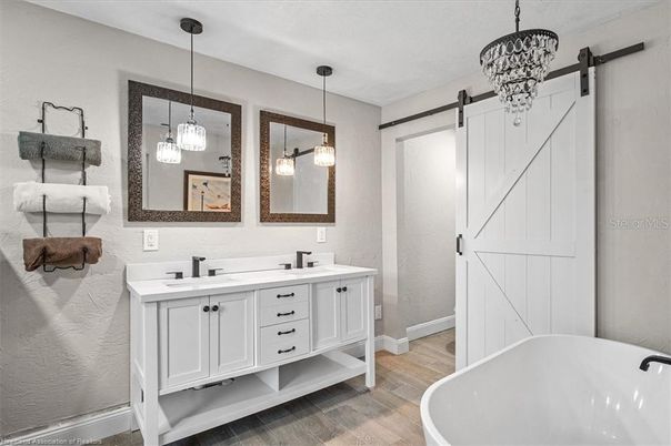 Bathroom, Dual Sink Vanities, Free Standing Baths, Interior, Pendant Lights, Wood Texture Flooring
