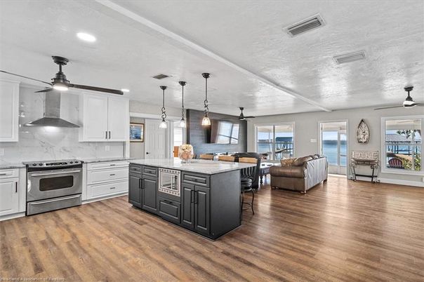 Dining room, Interior, Kitchen, Living room, Pendant Lights, Recessed Lighting, Stainless Steel Appliances, Wood Texture Flooring