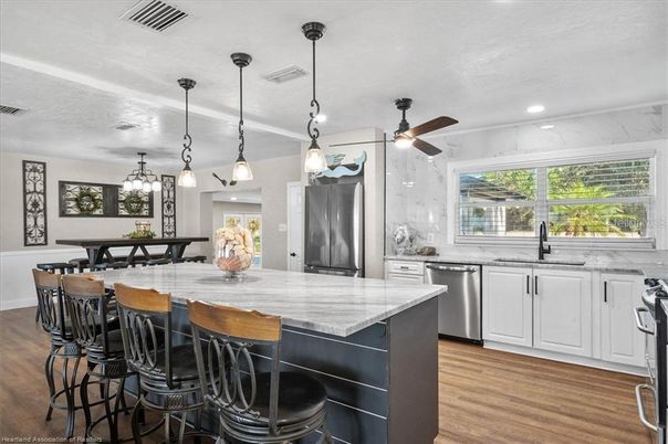 Interior, Kitchen, Pendant Lights, Recessed Lighting, Stainless Steel Appliances, Wood Texture Flooring