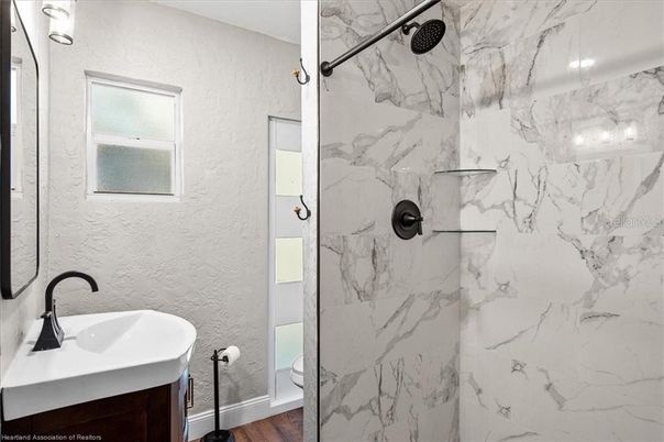 Bathroom, Glass Shower, Interior, Marble Walls, Wood Texture Flooring