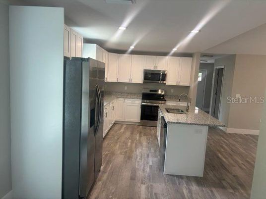 Interior, Kitchen, Recessed Lighting, Stainless Steel Appliances, Wood Texture Flooring