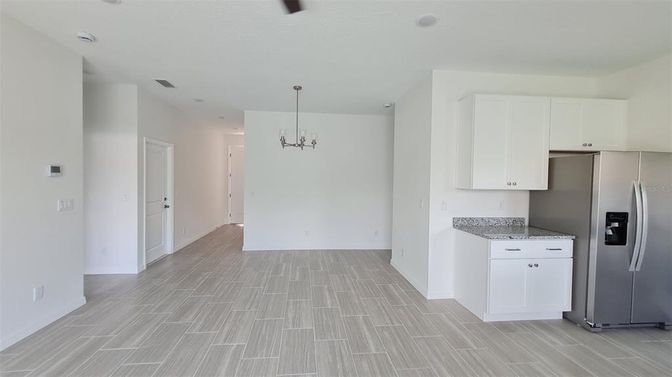 Chandelier, Empty room, Interior, Kitchen, Pendant Lights, Stainless Steel Appliances, Wood Texture Flooring