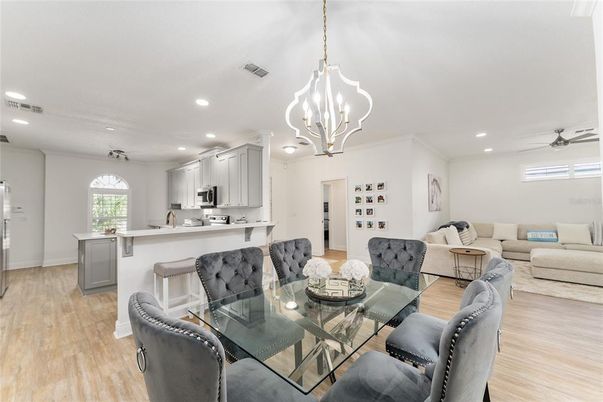 Chandelier, Dining room, Interior, Kitchen, Living room, Pendant Lights, Recessed Lighting, Wood Texture Flooring