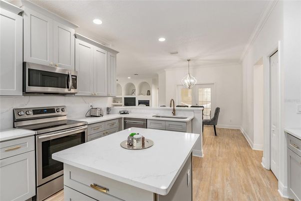 Dining room, Interior, Kitchen, Pendant Lights, Recessed Lighting, Stainless Steel Appliances, Wood Texture Flooring