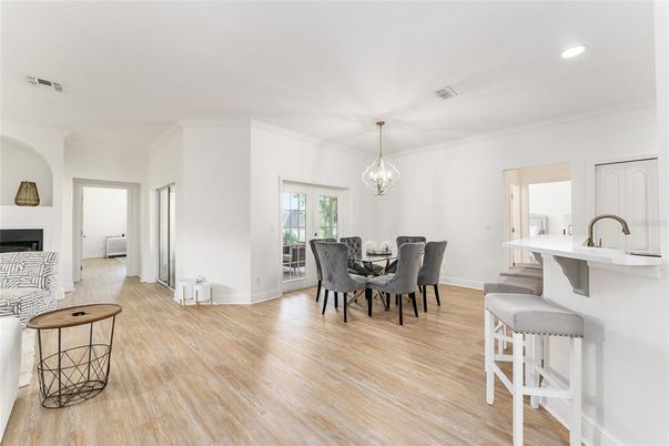 Dining room, Fireplace, Interior, Pendant Lights, Recessed Lighting, Wood Texture Flooring