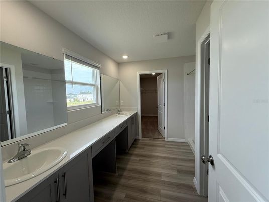 Bathroom, Dual Sink Vanities, Interior, Recessed Lighting, Wood Texture Flooring