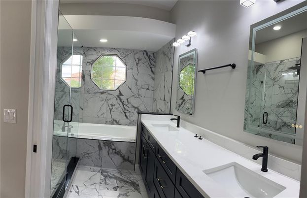 Bathroom, Dual Sink Vanities, Glass Shower, Interior, Marble, Marble Walls, Recessed Lighting