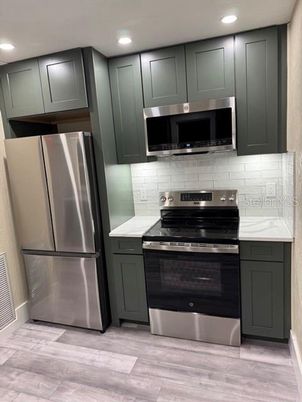 Interior, Kitchen, Recessed Lighting, Stainless Steel Appliances, Wood Texture Flooring