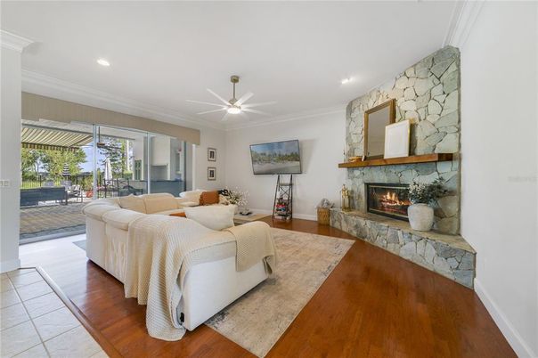 Fireplace, Interior, Living room, Recessed Lighting, Stone Walls, Wood Texture Flooring