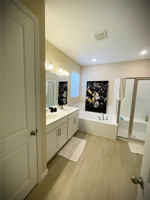 Bathroom, Dual Sink Vanities, Interior, Recessed Lighting, Wood Texture Flooring