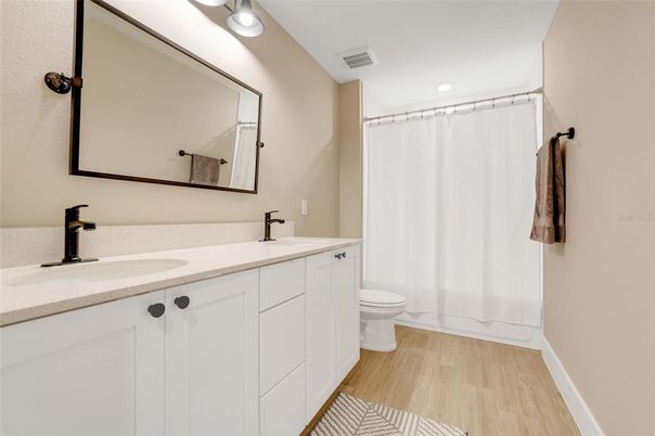Bathroom, Dual Sink Vanities, Interior, Recessed Lighting, Wood Texture Flooring