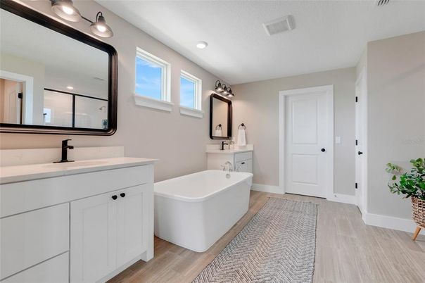 Bathroom, Dual Sink Vanities, Free Standing Baths, Interior, Recessed Lighting, Wood Texture Flooring