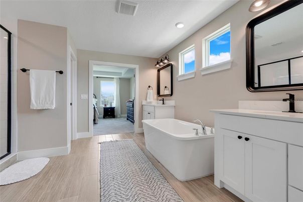 Bathroom, Dual Sink Vanities, Free Standing Baths, Interior, Recessed Lighting, Wood Texture Flooring