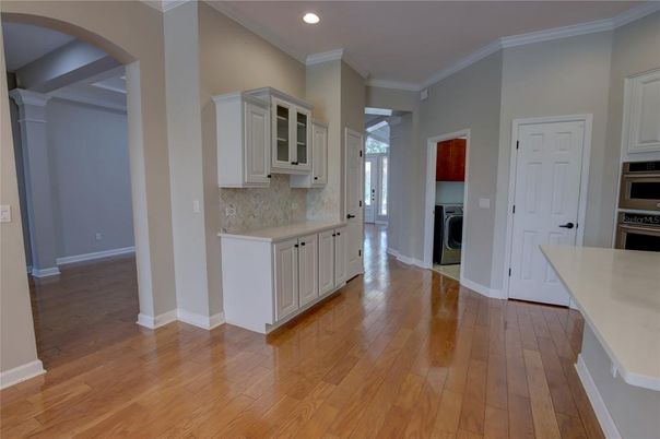 Interior, Kitchen, Recessed Lighting, Utility Closets, Washer, Wood Texture Flooring