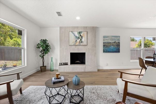 Dining room, Fireplace, Interior, Living room, Recessed Lighting, Wood Texture Flooring