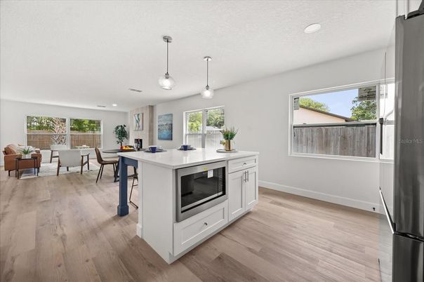 Dining room, Interior, Kitchen, Living room, Pendant Lights, Recessed Lighting, Wood Texture Flooring