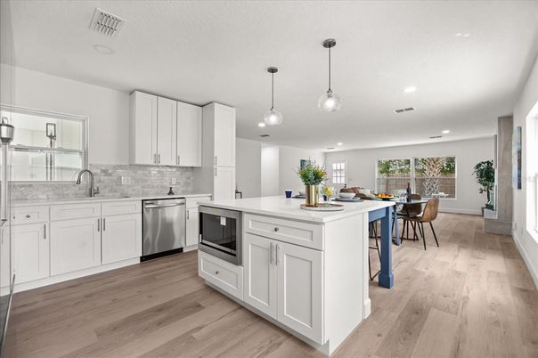 Dining room, Interior, Kitchen, Pendant Lights, Recessed Lighting, Stainless Steel Appliances, Wood Texture Flooring