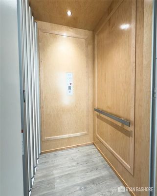 Elevator, Interior, Recessed Lighting, Wood Texture Flooring, Wooden Walls