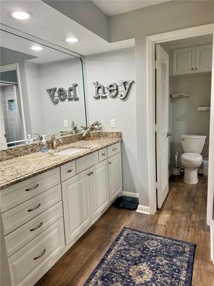 Bathroom, Dual Sink Vanities, Interior, Recessed Lighting, Wood Texture Flooring