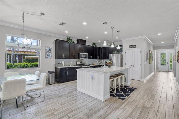 Dining room, Interior, Kitchen, Pendant Lights, Recessed Lighting, Stainless Steel Appliances, Wood Texture Flooring