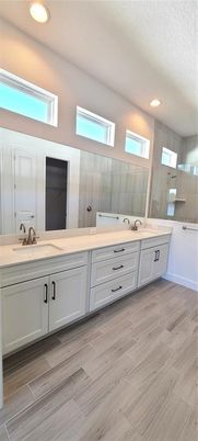 Bathroom, Dual Sink Vanities, Interior, Recessed Lighting, Wood Texture Flooring