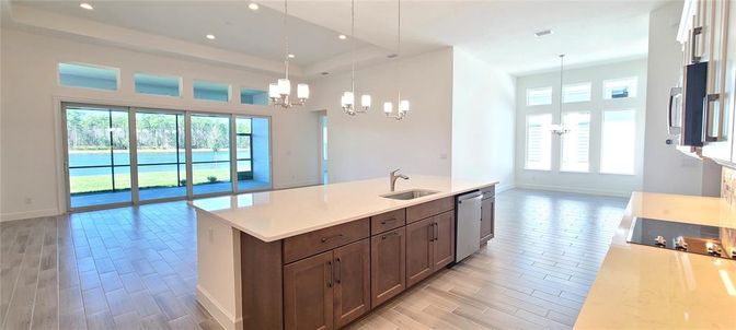 Chandelier, Fireplace, Interior, Kitchen, Pendant Lights, Recessed Lighting, Water, Wood Texture Flooring