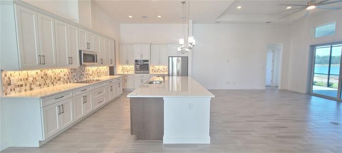 Interior, Kitchen, Pendant Lights, Recessed Lighting, Stainless Steel Appliances, Water, Wood Texture Flooring