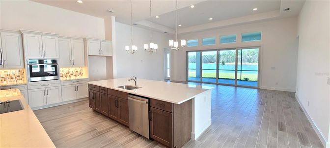 Chandelier, Interior, Kitchen, Pendant Lights, Recessed Lighting, Stainless Steel Appliances, Wood Texture Flooring