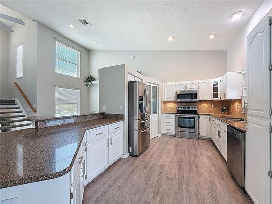 Interior, Kitchen, Recessed Lighting, Stainless Steel Appliances, Wood Texture Flooring