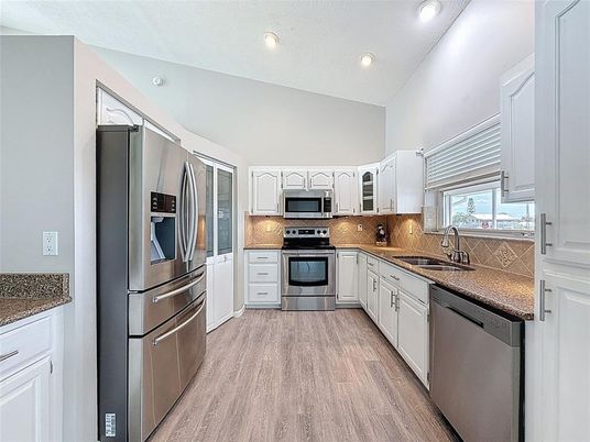 Interior, Kitchen, Recessed Lighting, Stainless Steel Appliances, Wood Texture Flooring