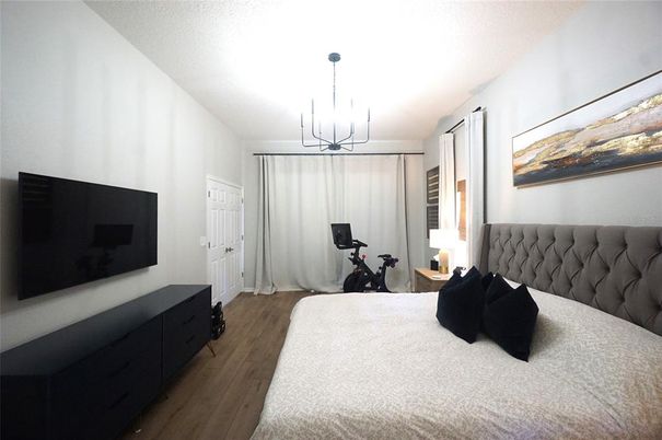 Bedroom, Chandelier, Fitness Equipment, Interior, Wood Texture Flooring