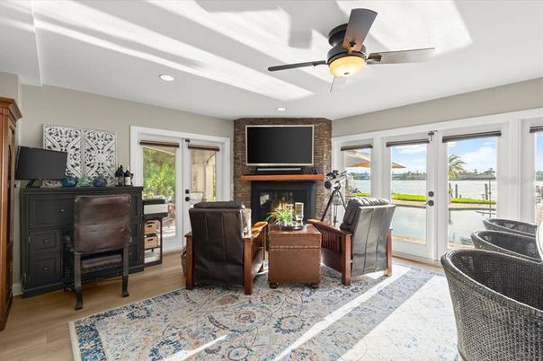 Fireplace, Interior, Living room, Recessed Lighting, Water, Wood Texture Flooring