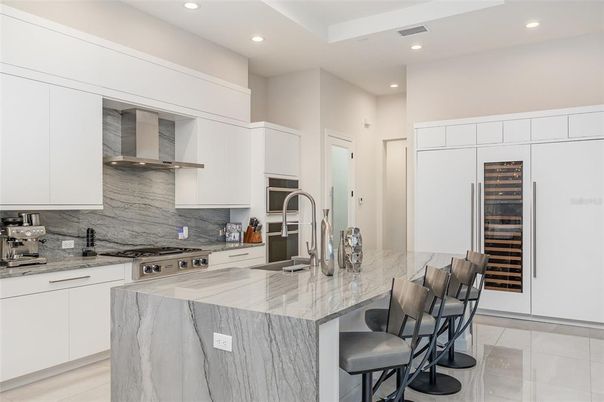 Interior, Kitchen, Marble Walls, Recessed Lighting, Stainless Steel Appliances