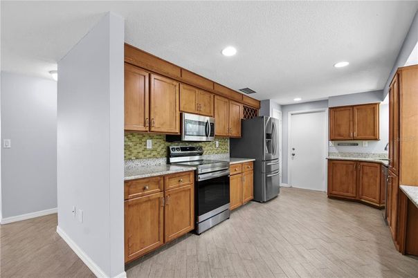 Interior, Kitchen, Recessed Lighting, Stainless Steel Appliances, Wood Texture Flooring