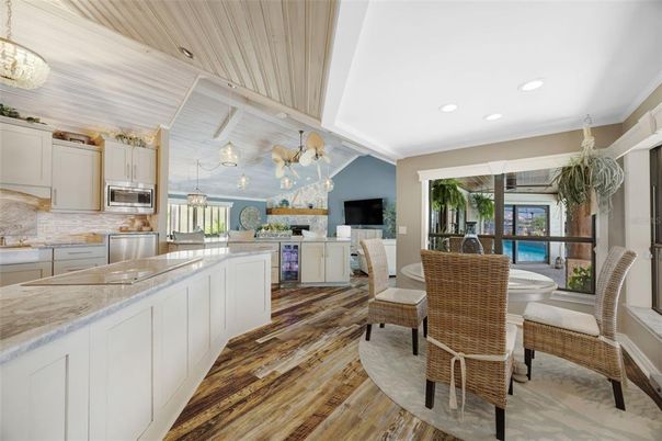 Dining room, Interior, Kitchen, Pendant Lights, Recessed Lighting, Stainless Steel Appliances, Wood Texture Flooring