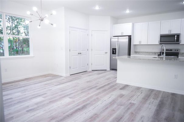 Interior, Kitchen, Pendant Lights, Recessed Lighting, Stainless Steel Appliances, Wood Texture Flooring