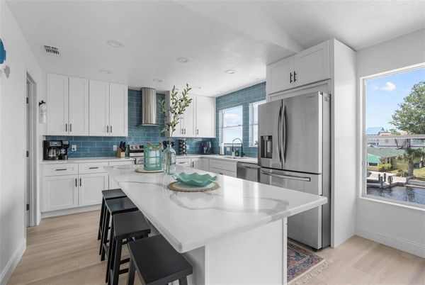 Interior, Kitchen, Recessed Lighting, Stainless Steel Appliances, Water, Wood Texture Flooring