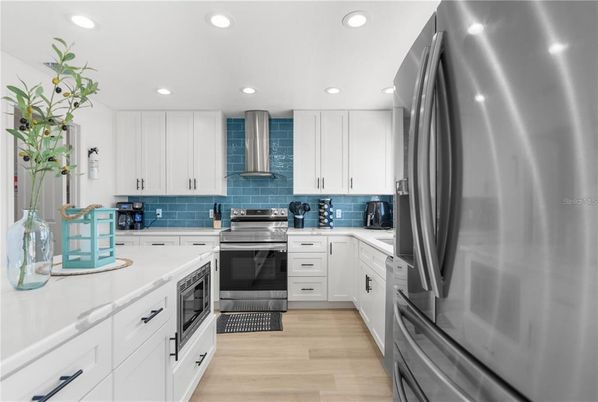 Interior, Kitchen, Recessed Lighting, Stainless Steel Appliances, Wood Texture Flooring