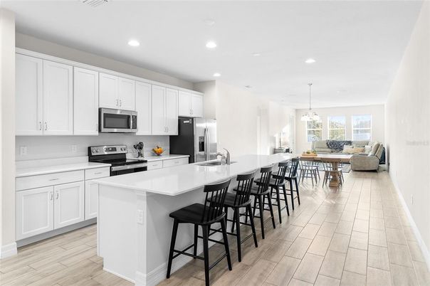 Dining room, Interior, Kitchen, Living room, Pendant Lights, Recessed Lighting, Stainless Steel Appliances, Wood Texture Flooring
