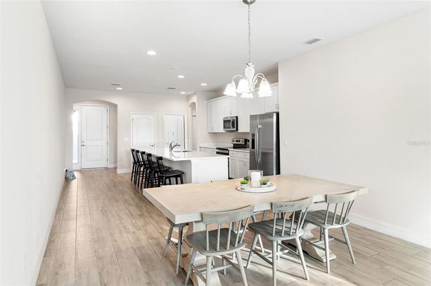 Dining room, Interior, Kitchen, Pendant Lights, Recessed Lighting, Stainless Steel Appliances, Wood Texture Flooring