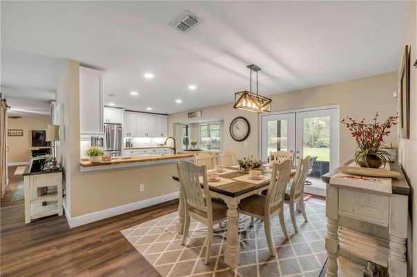 Dining room, Interior, Kitchen, Pendant Lights, Recessed Lighting, Stainless Steel Appliances, Wood Texture Flooring