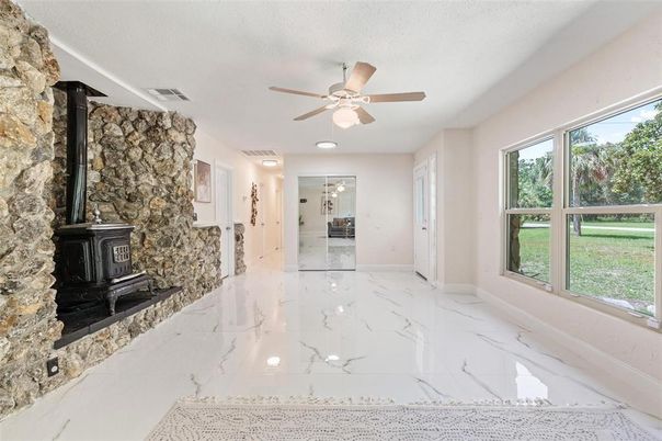 Empty room, Fireplace, Interior, Marble, Recessed Lighting, Stone Walls