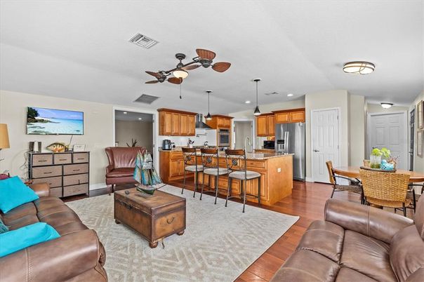 Dining room, Interior, Kitchen, Living room, Pendant Lights, Recessed Lighting, Stainless Steel Appliances, Wood Texture Flooring