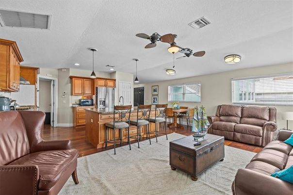 Dining room, Interior, Kitchen, Living room, Pendant Lights, Recessed Lighting, Stainless Steel Appliances, Wood Texture Flooring