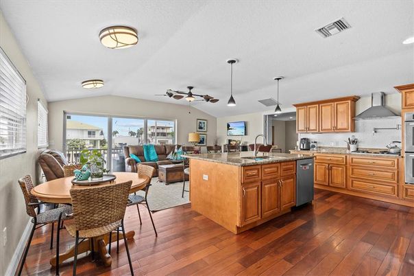 Dining room, Interior, Kitchen, Living room, Pendant Lights, Recessed Lighting, Stainless Steel Appliances, Wood Texture Flooring